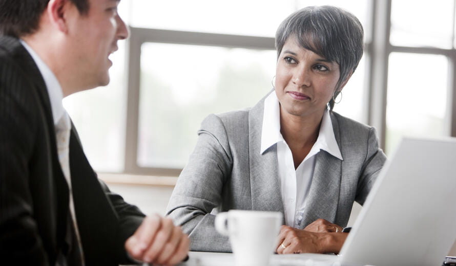 Two employee in the meeting room.